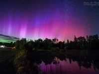 Aurora borealis over my back yard pond in Lee, Maine