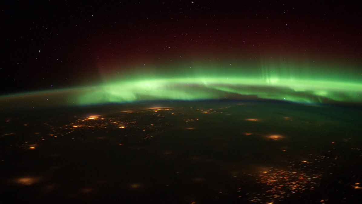 An astronaut aboard the International Space Station captured this photo of auroras glowing above the Midwest on Jan. 25, 2012.