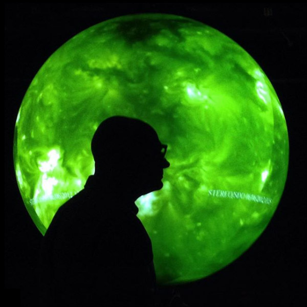 C. Alex Young in front of Science On a Sphere