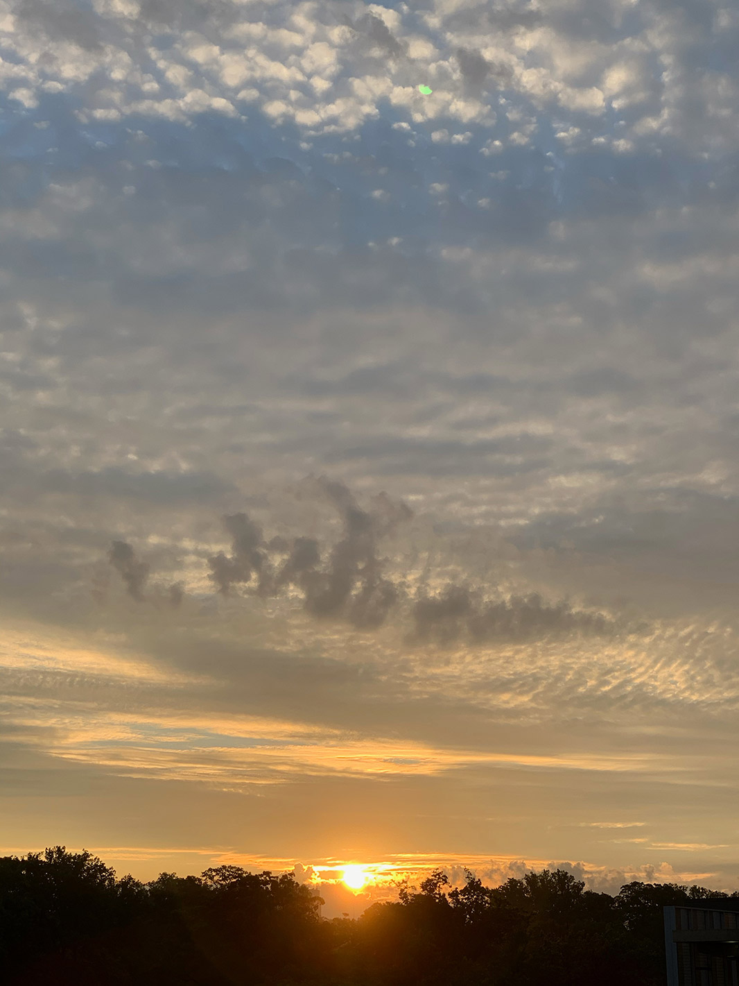 Partial Solar Eclipse viewing conditions - between the clouds at sunrise in Towson, MD! Thursday, June 10, 2021 - photo by Linda Schenk